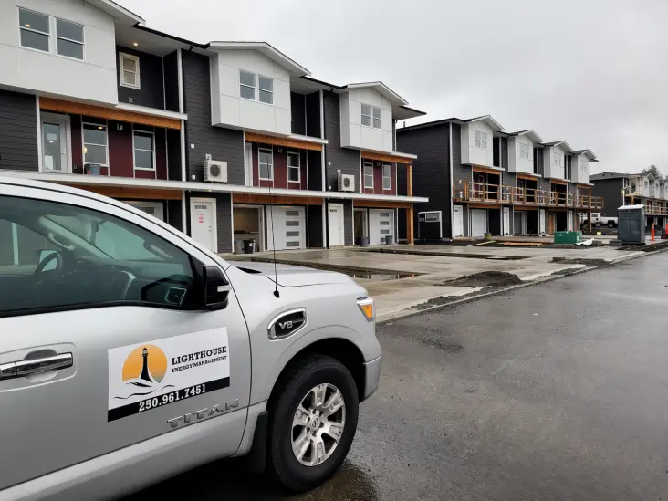 Lighthouse Energy Management vehicle parked at a residential project site